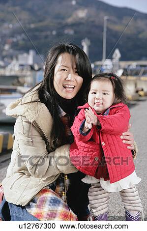 Stock Image - Portrait of mother and daughter. Fotosearch