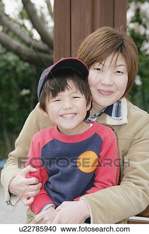Stock Image - Portrait of mother and son. Fotosearch