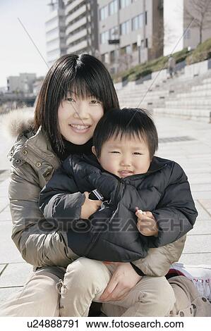 Stock Image - Portrait of mother and son. Fotosearch