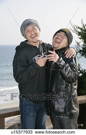 Portrait of two men laughing View Large Photo Image Stock Image - Portrait of two men laughing. Fotosearch
