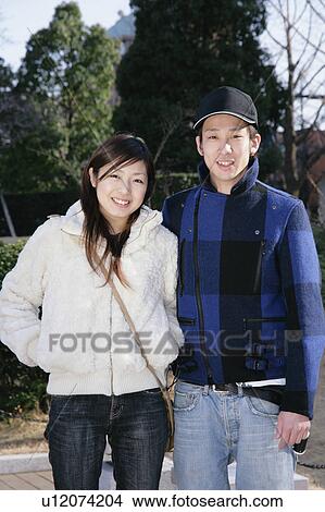 Picture - Portrait of young couple standing. Fotosearch