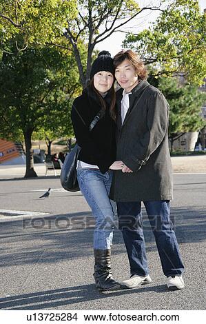 Picture - Portrait of young couple standing. Fotosearch