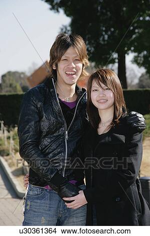 Picture - Portrait of young couple standing. Fotosearch