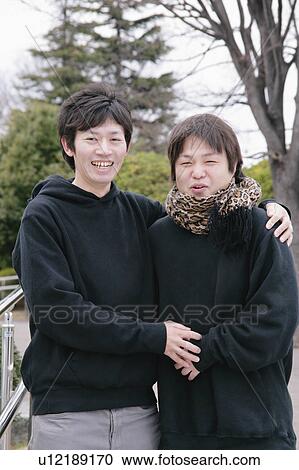 Stock Image - Portrait of young men smiling. Fotosearch