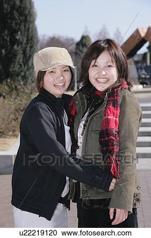Stock Image - Portrait of young women smiling. Fotosearch
