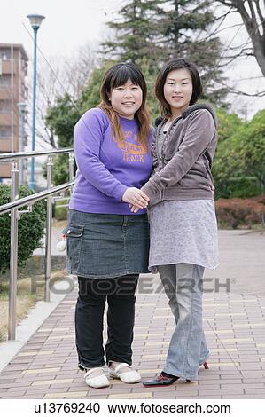 Stock Image - Portrait of young women. Fotosearch