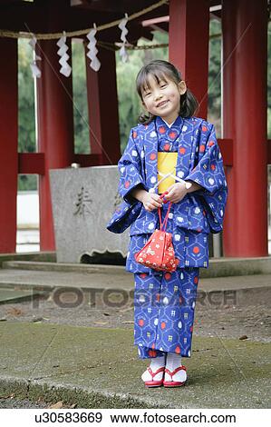 Portrait of a girl wearing kimono View Large Photo Image Stock Photo - Portrait of a girl wearing kimono. Fotosearch