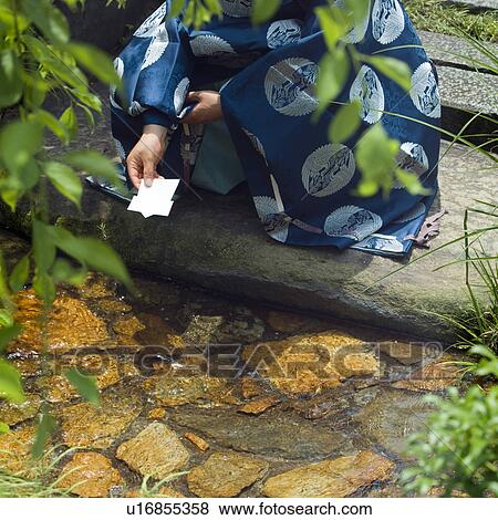Stock Photo - Shinto priest crouching. Fotosearch
