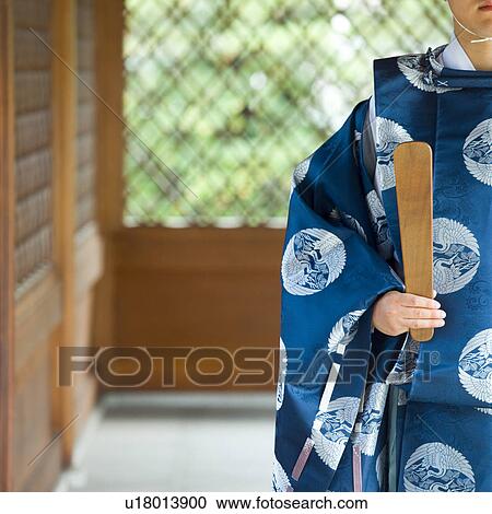 Shinto priest walking at shrine View Large Photo Image Stock Image - Shinto priest walking at shrine. Fotosearch