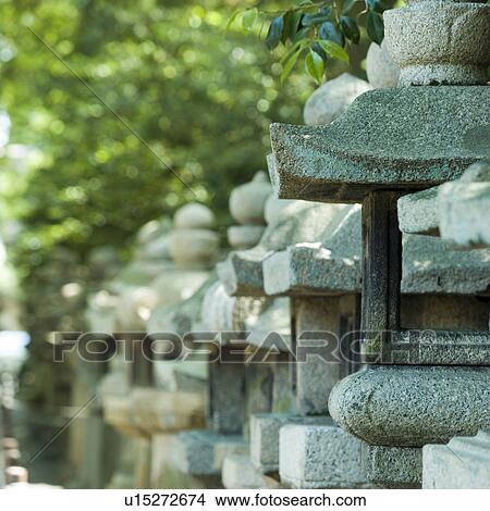 Picture - Stone lanterns at shrine. Fotosearch