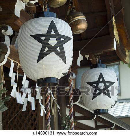 Stock Image - Lantern hanging at shrine. Fotosearch