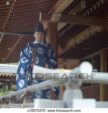 Shinto priest walking at shrine View Large Photo Image Stock Image - Shinto priest walking at shrine. Fotosearch