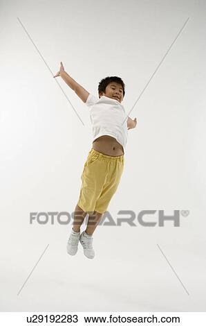 Boy jumping View Large Photo Image Stock Image - Boy jumping. Fotosearch