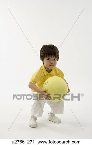 Boy playing with ball View Large Photo Image Stock Image - Boy playing with ball. Fotosearch