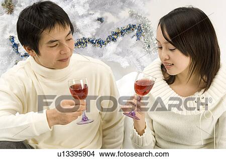 Couple toasting wine View Large Photo Image Picture - Couple toasting wine. Fotosearch