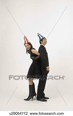 Couple wearing party hats View Large Photo Image Stock Image - Couple wearing party hats. Fotosearch
