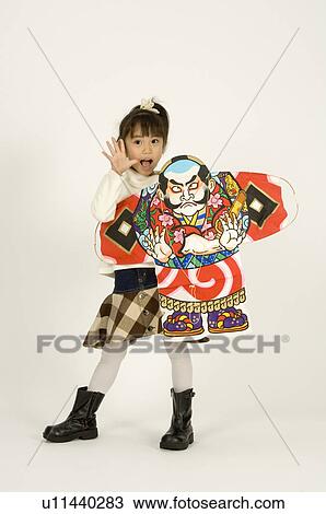 Stock Image - Girl holding kite. Fotosearch