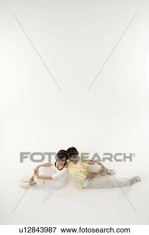 Husband and wife sitting back to back View Large Photo Image Stock Photo - Husband and wife sitting back to back. Fotosearch