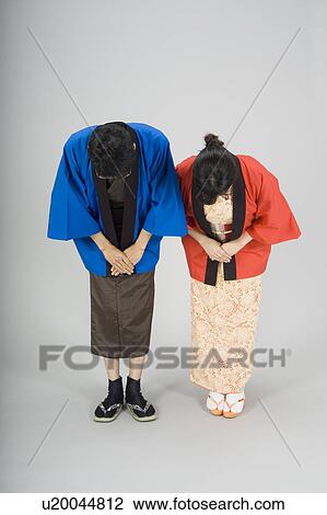 Man and woman bowing View Large Photo Image Stock Image - Man and woman bowing. Fotosearch
