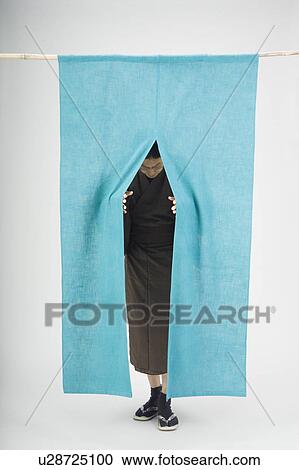 Man pushing past curtain View Large Photo Image Stock Image - Man pushing past curtain. Fotosearch
