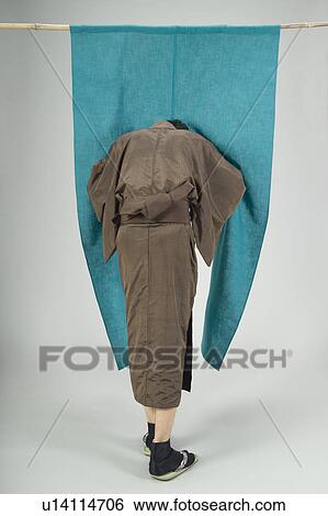Man pushing past curtain View Large Photo Image Stock Photograph - Man pushing past curtain. Fotosearch