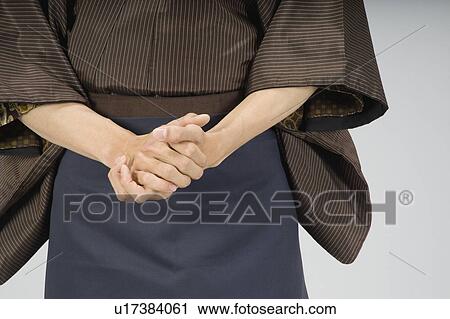 Man rubbing his hands together View Large Photo Image Stock Image - Man rubbing his hands together. Fotosearch