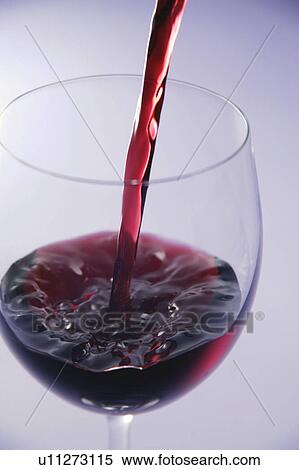 Red wine pouring into wineglass View Large Photo Image Stock Photography - Red wine pouring into wineglass. Fotosearch