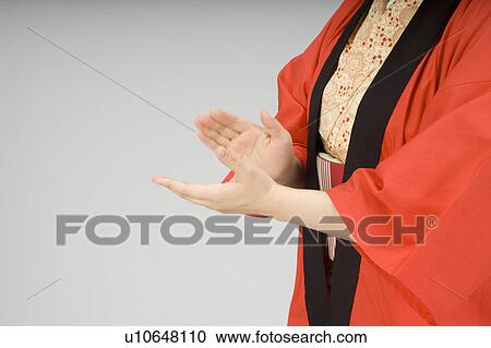 Stock Image - Woman clapping hands. Fotosearch