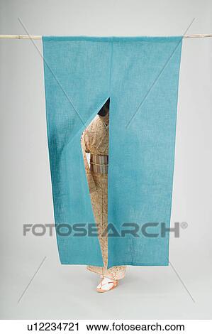 Woman pushing past curtain View Large Photo Image Stock Image - Woman pushing past curtain. Fotosearch