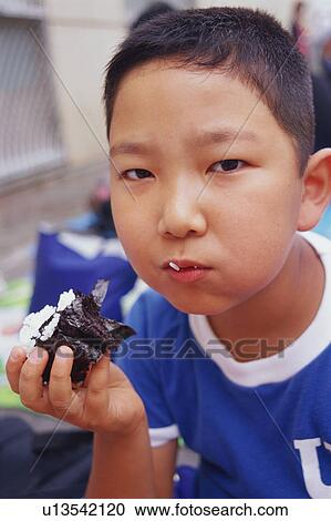Boy having lunch on school sports day View Large Photo Image Stock Image - Boy having lunch on school sports day. Fotosearch