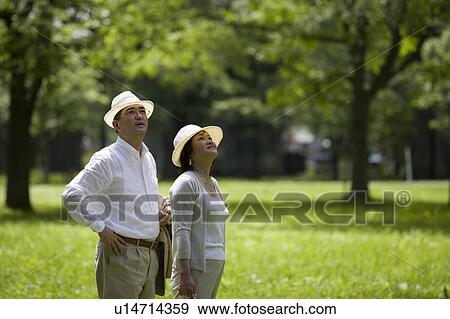 Mature couple standing View Large Photo Image Stock Photo - Mature couple standing. Fotosearch