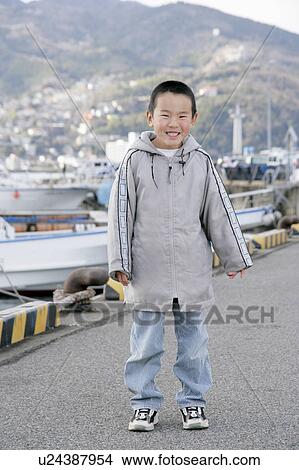 Picture - Portrait of a boy standing. Fotosearch