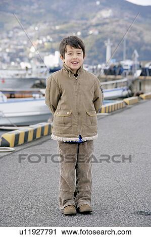Portrait of a boy standing View Large Photo Image Stock Image - Portrait of a boy standing. Fotosearch