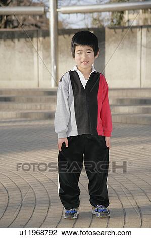Stock Image - Portrait of a boy standing. Fotosearch