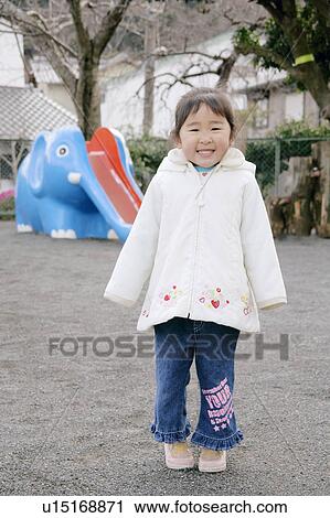 Stock Image - Portrait of a girl smiling. Fotosearch