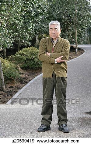 Stock Photo - Portrait of a senior man standing. Fotosearch