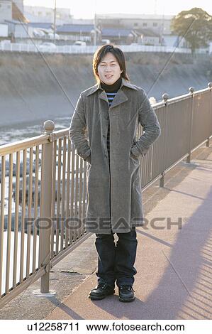 Portrait of a young man smiling View Large Photo Image Stock Image - Portrait of a young man smiling. Fotosearch