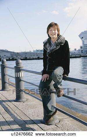 Portrait of a young man smiling View Large Photo Image Stock Image - Portrait of a young man smiling. Fotosearch