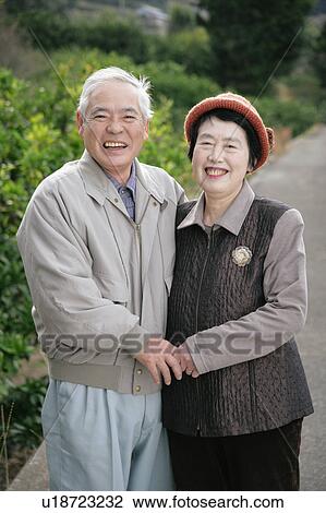 Stock Image - Portrait of senior couple standing. Fotosearch