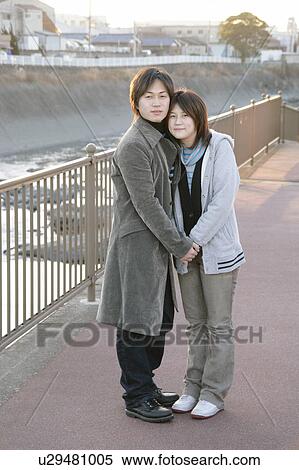 Portrait of young couple embracing View Large Photo Image Stock Photography - Portrait of young couple embracing. Fotosearch
