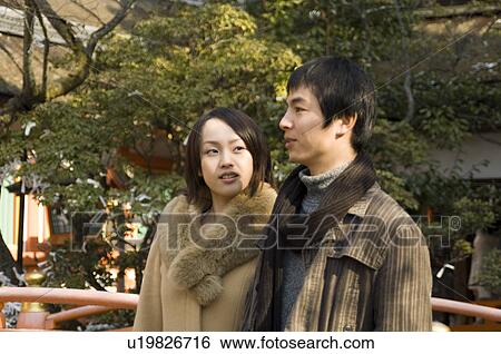 Stock Photograph - Couple at shrine. Fotosearch