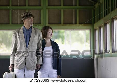 Senior couple walking View Large Photo Image Stock Image - Senior couple walking. Fotosearch