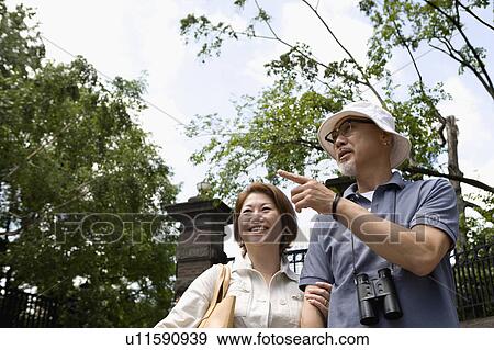 Senior couple walking View Large Photo Image Stock Photo - Senior couple walking. Fotosearch