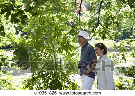 Stock Photograph - Senior couple walking. Fotosearch