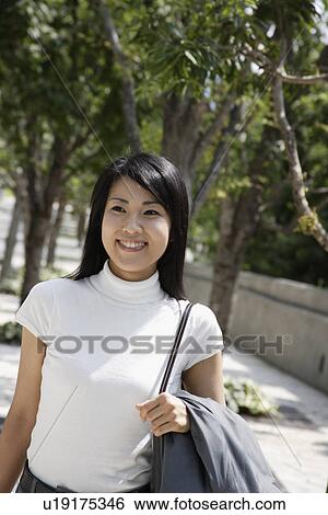 A side view of a woman expressing her happiness View Large Photo Image Stock Photograph - A side view of a woman expressing her happiness. Fotosearch