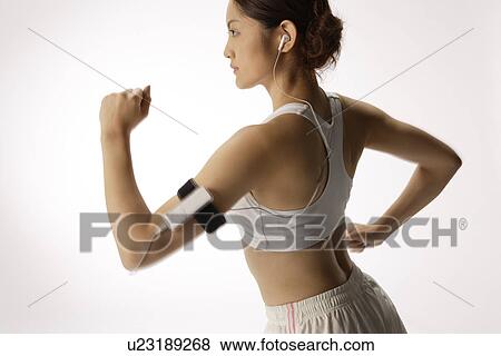 Stock Photo - Close-up of a young woman exercising. Fotosearch