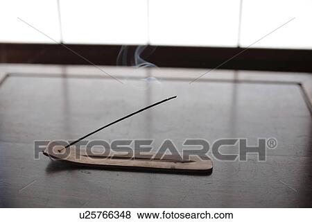 Close-up of an incense stick on a stand View Large Photo Image Stock Photo - Close-up of an incense stick on a stand. Fotosearch