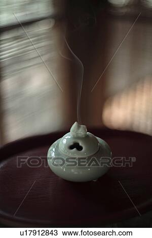 Close-up of white incense burner View Large Photo Image Stock Image - Close-up of white incense burner. Fotosearch