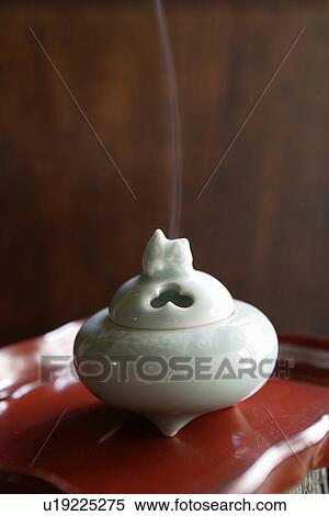 Stock Photography - Close-up of white incense burner. Fotosearch