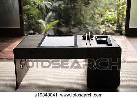 Stock Image - Front view of painting article on a table. Fotosearch